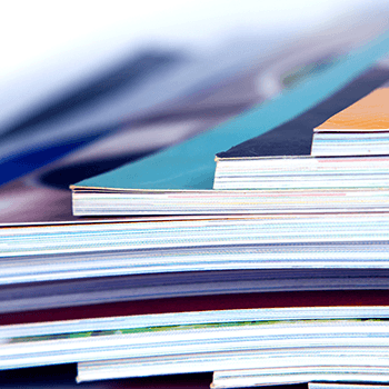 Photograph of documents arranged in a stack.